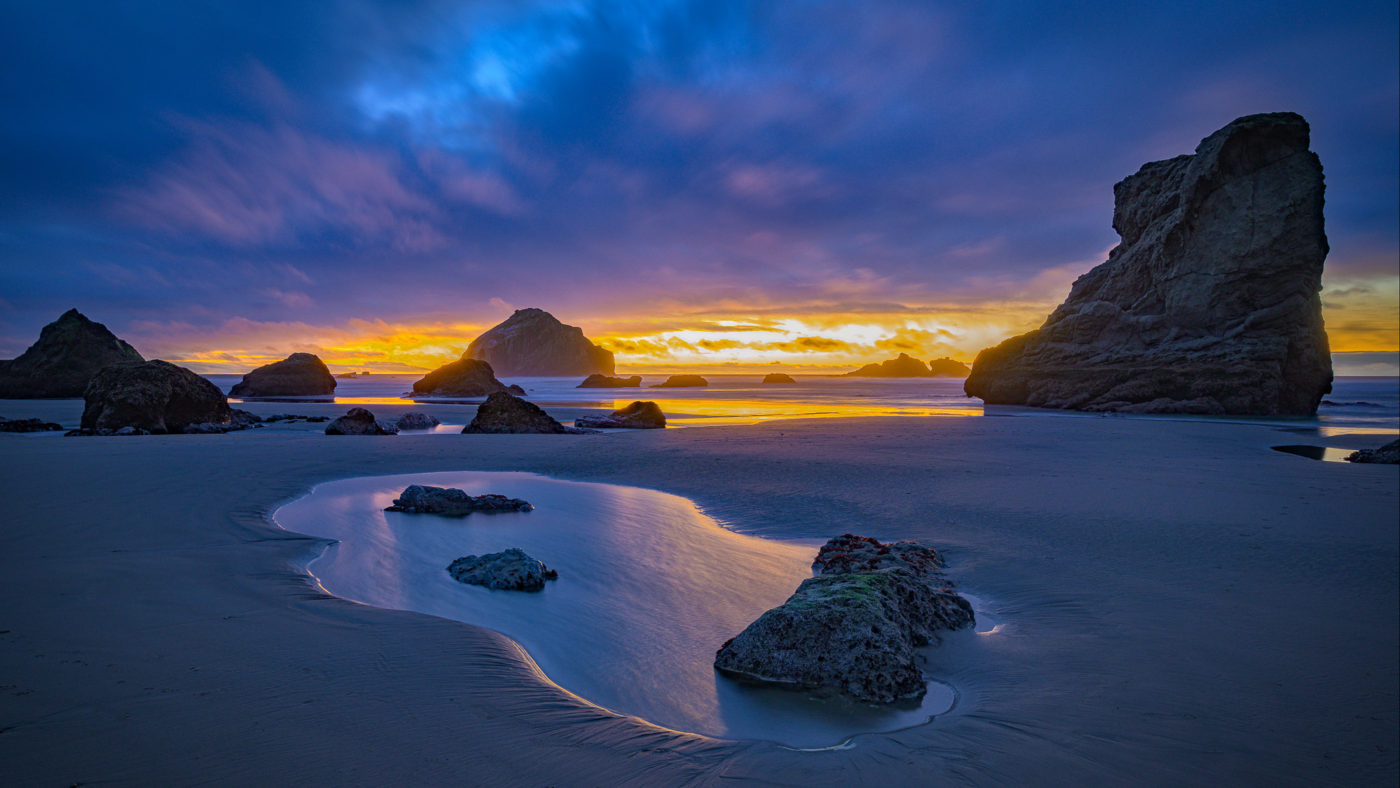 Bandon Beach and sea stacks on the Oregon Coast at sunset. 